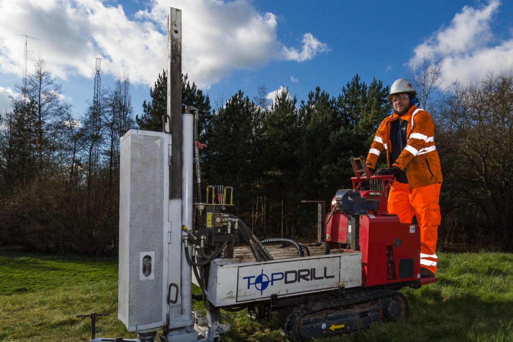 Topdrill drilling machine and worker